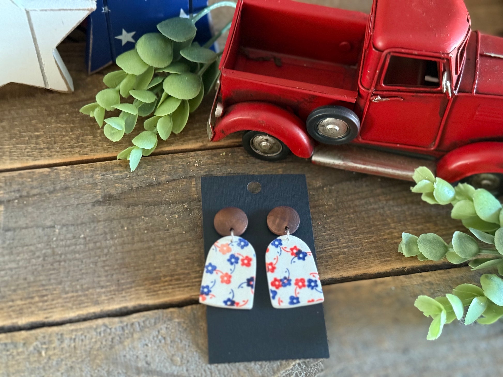 Stars and Clay- White Dangle with Red and Blue Flowers